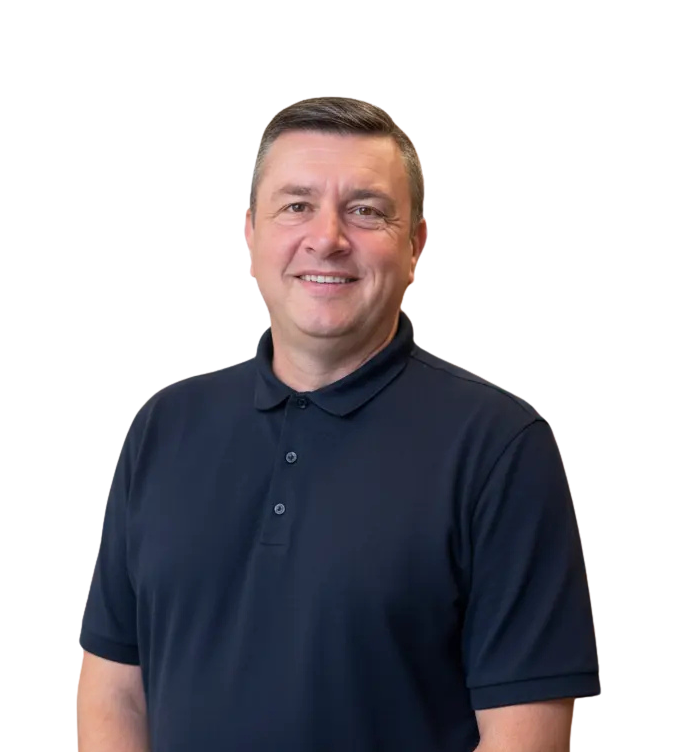 Person in a navy polo shirt smiling, representing Plastoplan Plastics UK, plastic distribution.